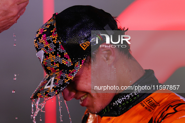 Lando Norris of the United Kingdom and McLaren Formula 1 Team celebrates winning the F1 Grand Prix of Singapore at Marina Bay Street Circuit...