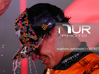 Lando Norris of the United Kingdom and McLaren Formula 1 Team celebrates winning the F1 Grand Prix of Singapore at Marina Bay Street Circuit...