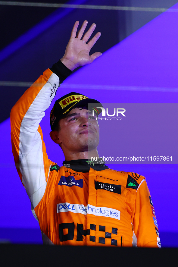 Lando Norris of the United Kingdom and McLaren Formula 1 Team celebrates winning the F1 Grand Prix of Singapore at Marina Bay Street Circuit...