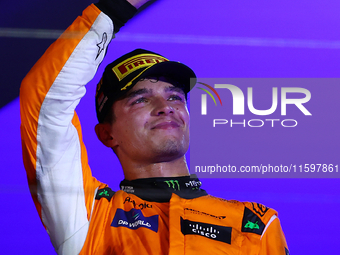 Lando Norris of the United Kingdom and McLaren Formula 1 Team celebrates winning the F1 Grand Prix of Singapore at Marina Bay Street Circuit...