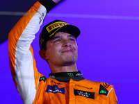 Lando Norris of the United Kingdom and McLaren Formula 1 Team celebrates winning the F1 Grand Prix of Singapore at Marina Bay Street Circuit...