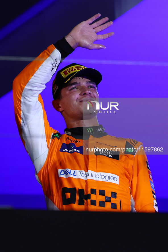 Lando Norris of the United Kingdom and McLaren Formula 1 Team celebrates winning the F1 Grand Prix of Singapore at Marina Bay Street Circuit...