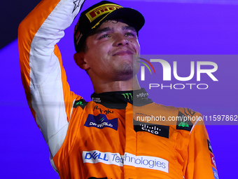 Lando Norris of the United Kingdom and McLaren Formula 1 Team celebrates winning the F1 Grand Prix of Singapore at Marina Bay Street Circuit...