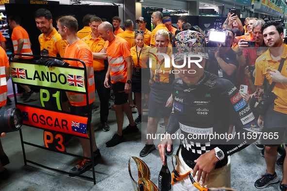 Lando Norris of the United Kingdom and the McLaren Formula 1 Team and Oscar Piastri of Australia and the McLaren Formula 1 Team celebrate fi...