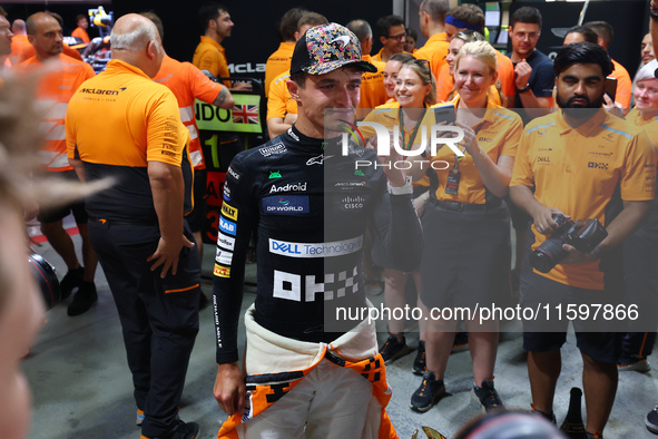 Lando Norris of the United Kingdom and McLaren Formula 1 Team celebrates winning the F1 Grand Prix of Singapore at Marina Bay Street Circuit...