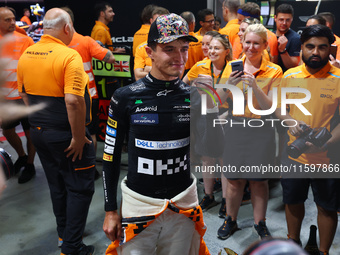 Lando Norris of the United Kingdom and McLaren Formula 1 Team celebrates winning the F1 Grand Prix of Singapore at Marina Bay Street Circuit...