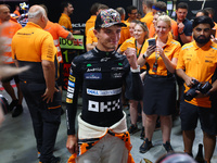 Lando Norris of the United Kingdom and McLaren Formula 1 Team celebrates winning the F1 Grand Prix of Singapore at Marina Bay Street Circuit...