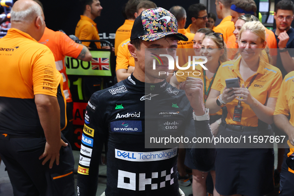 Lando Norris of the United Kingdom and McLaren Formula 1 Team celebrates winning the F1 Grand Prix of Singapore at Marina Bay Street Circuit...