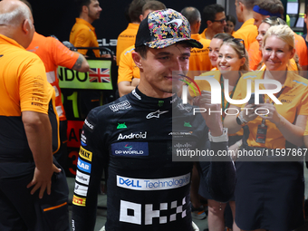 Lando Norris of the United Kingdom and McLaren Formula 1 Team celebrates winning the F1 Grand Prix of Singapore at Marina Bay Street Circuit...