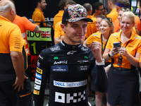 Lando Norris of the United Kingdom and McLaren Formula 1 Team celebrates winning the F1 Grand Prix of Singapore at Marina Bay Street Circuit...