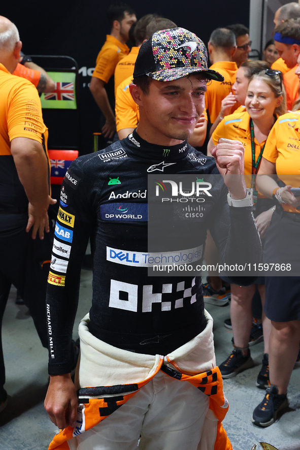 Lando Norris of the United Kingdom and McLaren Formula 1 Team celebrates winning the F1 Grand Prix of Singapore at Marina Bay Street Circuit...