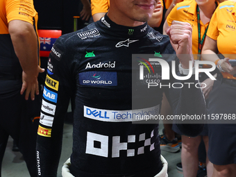 Lando Norris of the United Kingdom and McLaren Formula 1 Team celebrates winning the F1 Grand Prix of Singapore at Marina Bay Street Circuit...