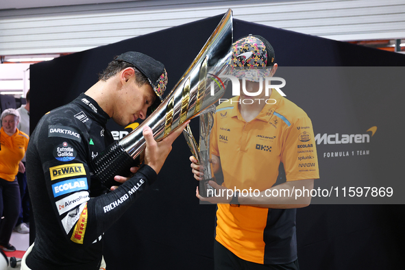 Lando Norris of the United Kingdom and the McLaren Formula 1 Team and Oscar Piastri of Australia and the McLaren Formula 1 Team celebrate fi...