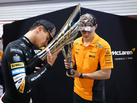 Lando Norris of the United Kingdom and the McLaren Formula 1 Team and Oscar Piastri of Australia and the McLaren Formula 1 Team celebrate fi...