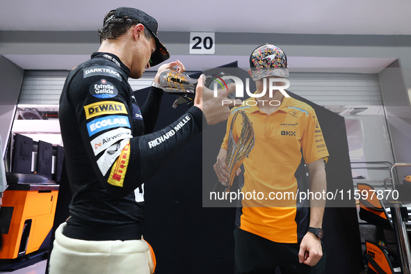 Lando Norris of the United Kingdom and the McLaren Formula 1 Team and Oscar Piastri of Australia and the McLaren Formula 1 Team celebrate fi...