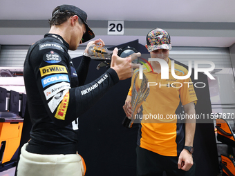 Lando Norris of the United Kingdom and the McLaren Formula 1 Team and Oscar Piastri of Australia and the McLaren Formula 1 Team celebrate fi...