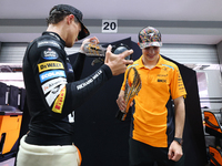 Lando Norris of the United Kingdom and the McLaren Formula 1 Team and Oscar Piastri of Australia and the McLaren Formula 1 Team celebrate fi...