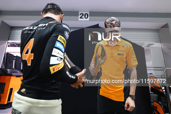 Lando Norris of the United Kingdom and the McLaren Formula 1 Team and Oscar Piastri of Australia and the McLaren Formula 1 Team celebrate fi...