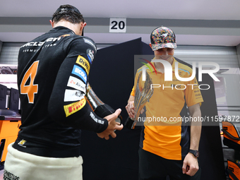 Lando Norris of the United Kingdom and the McLaren Formula 1 Team and Oscar Piastri of Australia and the McLaren Formula 1 Team celebrate fi...