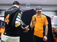 Lando Norris of the United Kingdom and the McLaren Formula 1 Team and Oscar Piastri of Australia and the McLaren Formula 1 Team celebrate fi...