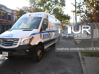 NYPD crime scene investigators search and mark evidence after a 42-year-old man is killed by gunshots to the shoulder and arm in the East Ne...