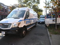 NYPD crime scene investigators search and mark evidence after a 42-year-old man is killed by gunshots to the shoulder and arm in the East Ne...