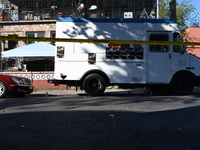 NYPD crime scene investigators search and mark evidence after a 42-year-old man is killed by gunshots to the shoulder and arm in the East Ne...