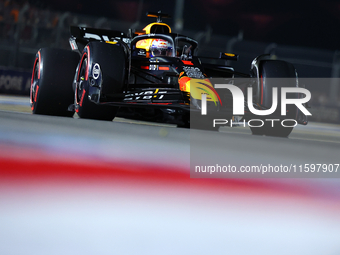 Max Verstappen of the Netherlands and Red Bull Racing-Honda RBPT drives to the grid ahead of the F1 Grand Prix of Singapore at Marina Bay St...