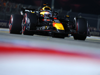 Max Verstappen of the Netherlands and Red Bull Racing-Honda RBPT drives to the grid ahead of the F1 Grand Prix of Singapore at Marina Bay St...