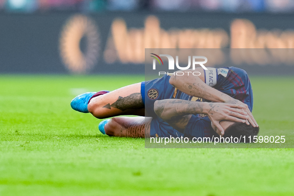 Lorenzo Pellegrini of AS Roma lies down injured during the Serie A Enilive match between AS Roma and Udinese Calcio at Stadio Olimpico on Se...