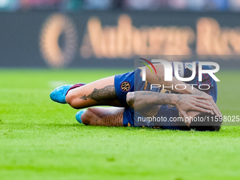 Lorenzo Pellegrini of AS Roma lies down injured during the Serie A Enilive match between AS Roma and Udinese Calcio at Stadio Olimpico on Se...