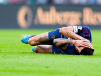 Lorenzo Pellegrini of AS Roma lies down injured during the Serie A Enilive match between AS Roma and Udinese Calcio at Stadio Olimpico on Se...