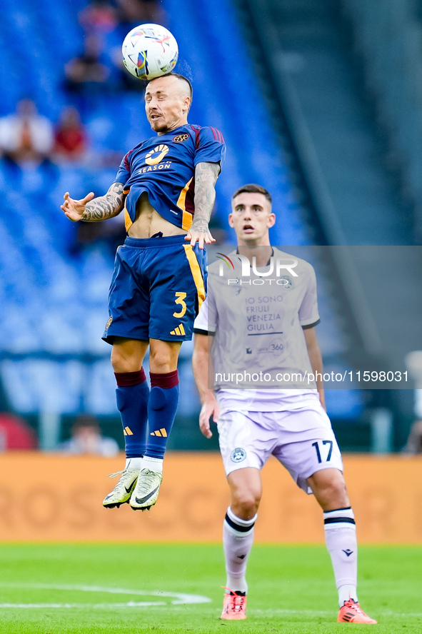 Angelino of AS Roma and Lorenzo Lucca of Udinese Calcio during the Serie A Enilive match between AS Roma and Udinese Calcio at Stadio Olimpi...