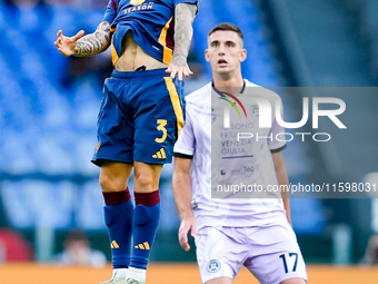 Angelino of AS Roma and Lorenzo Lucca of Udinese Calcio during the Serie A Enilive match between AS Roma and Udinese Calcio at Stadio Olimpi...