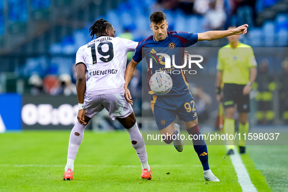 Stephan El Shaarawy of AS Roma and Kingsley Ehizibue of Udinese Calcio compete for the ball during the Serie A Enilive match between AS Roma...