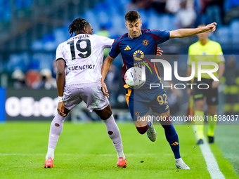 Stephan El Shaarawy of AS Roma and Kingsley Ehizibue of Udinese Calcio compete for the ball during the Serie A Enilive match between AS Roma...