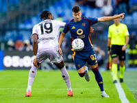 Stephan El Shaarawy of AS Roma and Kingsley Ehizibue of Udinese Calcio compete for the ball during the Serie A Enilive match between AS Roma...