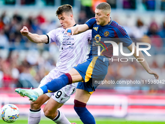 Artem Dovbyk of AS Roma and Jaka Bijol of Udinese Calcio compete for the ball during the Serie A Enilive match between AS Roma and Udinese C...