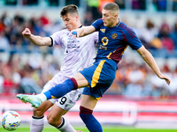 Artem Dovbyk of AS Roma and Jaka Bijol of Udinese Calcio compete for the ball during the Serie A Enilive match between AS Roma and Udinese C...