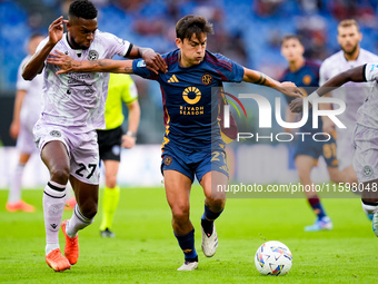 Paulo Dybala of AS Roma and Christian Kabasele of Udinese Calcio compete for the ball during the Serie A Enilive match between AS Roma and U...