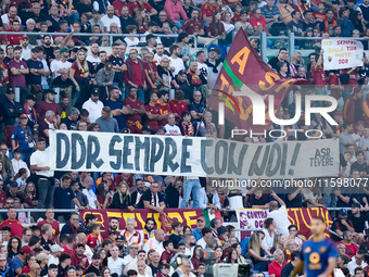 Supporters of AS Roma show a banner in support of Daniele De Rossi during the Serie A Enilive match between AS Roma and Udinese Calcio at St...