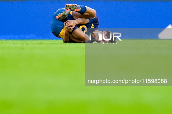 Paulo Dybala of AS Roma lies down injured during the Serie A Enilive match between AS Roma and Udinese Calcio at Stadio Olimpico on Septembe...