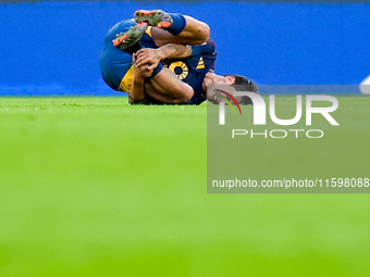 Paulo Dybala of AS Roma lies down injured during the Serie A Enilive match between AS Roma and Udinese Calcio at Stadio Olimpico on Septembe...