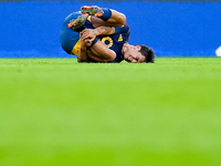 Paulo Dybala of AS Roma lies down injured during the Serie A Enilive match between AS Roma and Udinese Calcio at Stadio Olimpico on Septembe...