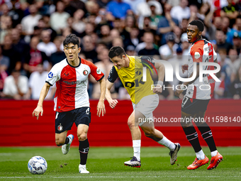 Feyenoord Rotterdam midfielder Inbeom Hwang, NAC Breda defender Dominik Janosek, and Feyenoord Rotterdam midfielder Antoni Milambo during th...