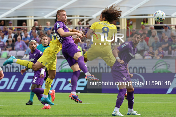 Pietro Comuzzo of ACF Fiorentina and Matteo Guendouzi of SS Lazio ,battle for the ball during the Italian Serie A football match between ACF...