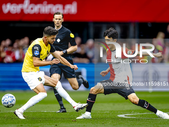 NAC Breda defender Fredrik Oldrup Jensen and Feyenoord Rotterdam midfielder Inbeom Hwang during the match between Feyenoord and NAC at Stadi...