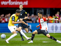 NAC Breda defender Fredrik Oldrup Jensen and Feyenoord Rotterdam midfielder Inbeom Hwang during the match between Feyenoord and NAC at Stadi...