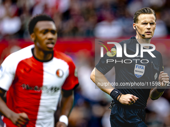 Referee Sander van der Eijk officiates the match between Feyenoord and NAC at Stadium De Kuip for the Dutch Eredivisie season 2024-2025 in R...