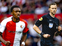 Referee Sander van der Eijk officiates the match between Feyenoord and NAC at Stadium De Kuip for the Dutch Eredivisie season 2024-2025 in R...